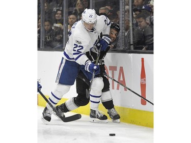 Toronto Maple Leafs defenseman Nikita Zaitsev, left, of Russia, and Los Angeles Kings center Alex Iafallo watch the puck during the second period of an NHL hockey game, Thursday, Nov. 2, 2017, in Los Angeles.