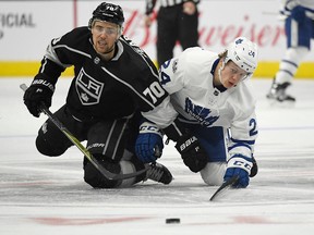 Tanner Pearson and Kasperi Kapanen battle for a loose puck