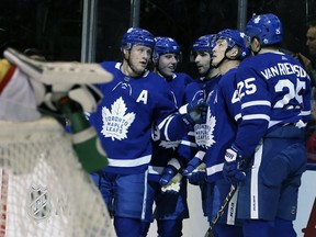Toronto Maple Leafs players celebrate Nazem Kadri's first goal