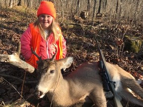 In this Nov. 19, 2017 photo provided by Tyler Harris, Lexie Harris, 6, poses after bagging a buck in Taylor County, Wis. Lexie is among the first youngsters to bag a buck under the state’s new law that eliminates the state’s minimum hunting age. She is no stranger to the woods. Her dad, Tyler Harris, has taken her hunting since she was three. But, it wasn’t until Gov. Scott Walker signed the law on Nov. 12 that Lexie could legally shoot a deer. (Tyler Harris via AP)