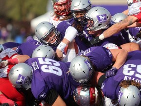 Chris Merchant scores on a quarterback sneak during an absolutely dominating performance by the Western Mustangs over the Guelph Gryphons in their semifinal at TD stadium on Saturday November 4, 2017. Mike Hensen/The London Free Press/Postmedia Network