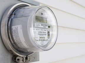 A London Hydro smart meter made by Sensus hangs on the outside wall of a house on Maitland Street in London on Wednesday July 24, 2013. The Ontario Electrical Safety Authority ordered the removal of 5,400 of the conservation devices. Craig Glover/London Free Press / QMI AGENCY
CRAIG GLOVER, CRAIG GLOVER