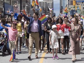 Prime Minister Justin Trudeau, his wife Sophie Gregoire Trudeau and their children Ella-Grace and Xavier walk in the Pride parade in Toronto on June 25, 2017.