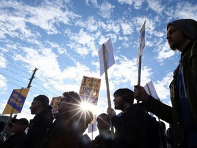 Supporters listen as Lindsay Shepherd speaks during a rally in support of freedom of expression at Wilfrid Laurier University in Waterloo on Friday November 24, 2017.