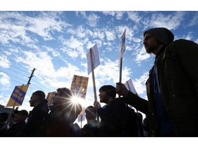 Supporters listen as Lindsay Shepherd speaks during a rally in support of freedom of expression at Wilfrid Laurier University in Waterloo on Friday November 24, 2017. (Dave Abel/Toronto Sun)