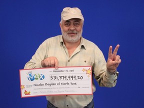 Nicolae Bogdan, of Toronto, poses with his Oct. 13, 2017 Lotto Max winnings.