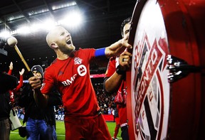 Toronto FC's Michael Bradley bangs on a drum after his team defeated the Philadelphia Union in MLS soccer playoff action in Toronto, Wednesday October 26, 2016. THE CANADIAN PRESS/Mark Blinch