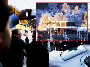 A crowd watches as the Georgia Dome is imploded in Atlanta, Monday, Nov. 20, 2017. The dome was not only the former home of the Atlanta Falcons but also the site of two Super Bowls, 1996 Olympics Games events and NCAA basketball tournaments among other major events. (AP Photo/David Goldman)