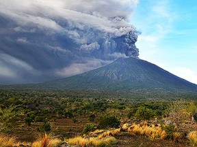 General view of Mount Agung during an eruption seen from Kubu sub-district in Karangasem Regency, on Indonesia's resort island of Bali on November 26, 2017.  Mount Agung belched smoke as high as 1,500 metres above its summit, sparking an exodus from settlements near the mountain. / AFP PHOTO / SONNY TUMBELAKASONNY TUMBELAKA/AFP/Getty Images