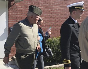 In this Tuesday, Oct., 31, 2017 photo, U.S. Marine Gunnery Sgt. Joseph A. Felix, his wife, and his lawyers exit a courtroom after testimony at Camp Lejeune, N.C.