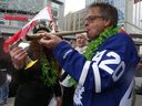 The Prince of Pot - Marc Emery - gets help firing up a huge joint during 4/20 celebrations at Yonge-Dundas Square on Thursday, April 20, 2017.