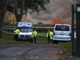 Police patrol the area near the scene of a mid-air collision between a helicopter and an aircraft, in Aylesbury, Buckinghamshire, England, Friday Nov. 17, 2017. A "number of casualties" were reported, authorities said. (Aaron Chown/PA via AP)