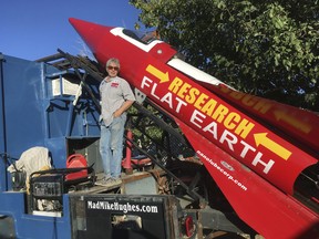 In this Wednesday, Nov. 15, 2017, photograph, daredevil/limousine driver Mad Mike Hughes is shown with with his steam=powered rocket constructed out of salvage parts on a five-acre property that he leases in Apple Valley, Cal. Hughes plans to launch his homemade contraption on Saturday near the ghost town of Amboy, Cal., at a speed of roughly 500 miles-per-hour. (Waldo Stakes/HO courtesy of Mad Mike Hughes via AP)