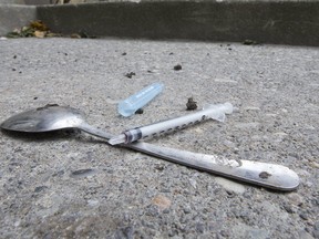 A discarded needle on Bond Street just blocks between The Works and Moss Park.  Needles used at the Safe Injection sites are collected on site and discarded safely. (STAN BEHAL/TORONTO SUN)