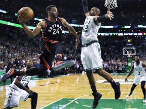 Raptors guard Norman Powell (24) looks to pass as Celtics centre Al Horford (42) attempts a block during NBA action in Boston, Feb. 1, 2017.
 (Charles Krupa/AP Photo)