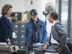 This image released by 20th Century Fox shows actress Meryl Streep, from left, director Steven Spielberg, and actor Tom Hanks on the set of "The Post." (Niko Tavernise/20th Century Fox via AP)