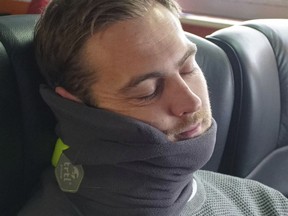 This undated image provided by trtl shows the trtl travel pillow. The trtl pillow supports the head and neck with a system of ribs inside a soft fleece, in a design that is very different from traditional U-shaped travel pillows. (Trtl via AP)