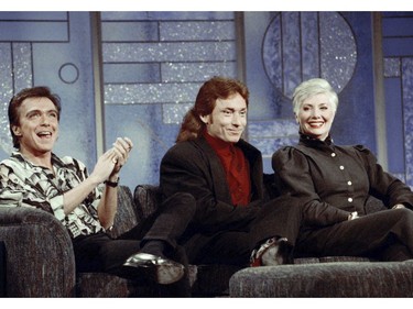 In this July 13, 1993, file photo, former Partridge Family cast members David Cassidy, from left, Danny Bonaduce and Shirley Jones reunite on the Arsenio Hall Show, Los Angeles, Calif. This was the first time the three had appeared together since the popular 1970s series left the air. Cassidy performed I Think I Love You, during the taping. (AP Photo/Eric Draper, File)