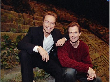 In this Nov. 11, 1997, file photo, David Cassidy, left, and brother Patrick sit on the stage of EFX at the MGM Grand in Las Vegas.  (AP Photo/Jack Dempsey, File)