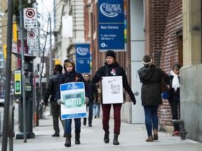 Teachers and faculty staff of the Ontario Public Service Employees Union walk the picket line at George Brown College in Toronto on Thursday, November 16, 2017.