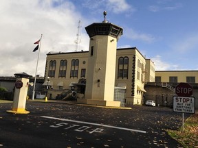 This Nov. 18, 2011 file photo shows the Oregon State Penitentiary, in Salem, Ore. An Oregon woman was sentenced to two years in federal prison in Portland, Ore., Tuesday, Nov. 21, 2017, on a drug conspiracy charge after her inmate boyfriend died from a meth-laden kiss at the Oregon State Penitentiary after a prison visit in 2016. (Danielle Peterson/Statesman-Journal via AP, File)