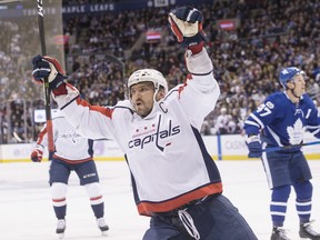Washington Capitals captain Alex Ovechkin celebrates after scoring his first of three goals against the Maple Leafs on Saturday night at the Air Canada Centre. (THE CANADIAN PRESS)