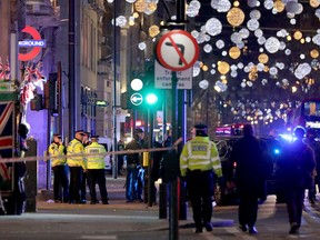 Police set up a cordon outside Oxford Circus underground station as they respond to an incident in central London on Nov. 24, 2017. (DANIEL LEAL-OLIVAS/AFP/Getty Images)