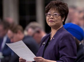 Minister of State (Seniors) Alice Wong responds to a question during Question Period in the House of Commons in Ottawa on March 13, 2012. THE CANADIAN PRESS/Adrian Wyld