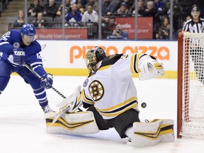 Maple Leafs centre Patrick Marleau (left) scores past Bruins goalie Anton Khudobin during overtime action in Toronto on Friday, Nov. 10, 2017. (Nathan Denette/The Canadian Press)