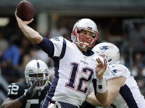 In this Sunday, Nov. 19, 2017, file photo, New England Patriots quarterback Tom Brady passes against the Oakland Raiders in Mexico City.