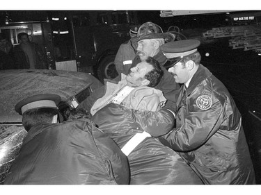PEAKE ARCHIVES: 1970s A man pulled out of his car at an accident by police and fire. We did a lot of photos like this from back then. Nowadays he would have likely stayed in the car until EMS arrived.