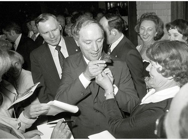 Prime Minister Pierre Trudeau pins a rose to his lapel while at a UJA function in Toronto June 5, 1978.