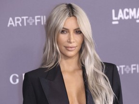 FILE - In this Nov. 4, 2017 file photo, Kim Kardashian West arrives at the LACMA Art + Film Gala at the Los Angeles County Museum of Art in Los Angeles. West is promoting Screenshop, which dishes up a range of shoppable fashion and accessory options based on a phone screen grab a user takes from social media or anywhere else. (Photo by Willy Sanjuan/Invision/AP, File)
