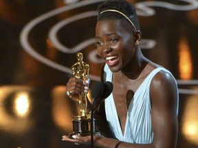 In this Sunday, March 2, 2014 file photo, Lupita Nyong'o accepts the award for best actress in a supporting role for "12 Years a Slave" during the Oscars at the Dolby Theatre in Los Angeles. British magazine Grazia U.K. on Friday Nov. 10, 2017, has apologized to Lupita Nyong'o after the actress accused it of altering her hair on its front cover "to fit a more Eurocentric notion" of beauty. (Photo by John Shearer/Invision/AP, File)