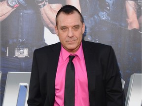 FILE - In this Aug. 11, 2014 file photo, actor Tom Sizemore arrives at the premiere of "The Expendables 3" in Los Angeles. Los Angeles prosecutors say Sizemore has been charged with three misdemeanors in connection with his arrest in a domestic violence case. The city's attorney's office says the actor was charged this week with intimate partner abuse, intimate partner battery and making terrorist threats. (Photo by Jordan Strauss/Invision/AP, File)