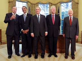 Then- U.S. President George W. Bush (C) meets with then-President-elect Barack Obama (2nd-L), former President Bill Clinton (2nd-R), former President Jimmy Carter (R) and former President George H.W. Bush (L) in the Oval Office  in Washington, D.C. in this Jan. 7, 2009 file photo.  (Mark Wilson/Getty Images)