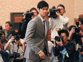 Japanese pitcher-outfielder Shohei Otani arrives for a press conference in Tokyo on Nov. 11, 2017