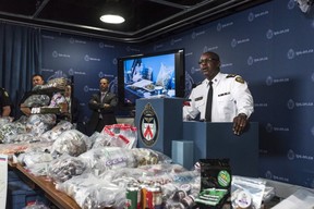 Toronto Police Chief Mark Saunders, surrounded by marijuana products including edibles and oils, speaks during a press conference to discuss results of a series of police raids conducted on companies allegedly selling marijuana illegally, dubbed Project Claudia, in Toronto on Friday, May 27, 2016.