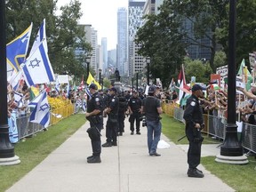 Toronto Police keep Al-Quds Day participants and Israeli supporters separate at Queen's Park on July 26, 2014. (Veronica Henri, Veronica Henri/Toronto Sun)