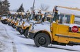 School buses sit ideal at Downsview Park in Toronto.