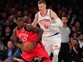 Toronto Raptors forward Pascal Siakam looks to drive against New York Knicks forward Kristaps Porzingis on Nov. 22, 2017