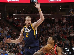 Utah Jazz's Joe Ingles (2) defends as Toronto Raptors' DeMar DeRozan (10) looks to shoot the ball in the first half of an NBA basketball game Friday, The Associated Press