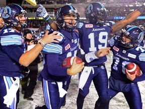 Toronto Argonauts quarterback Ricky Ray celebrates with teammates after defeating the Calgary Stampeders in the Grey Cup on Nov. 26, 2017