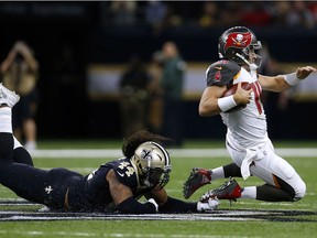 Hau'oli Kikaha of the New Orleans Saints tackles Ryan Fitzpatrick of the Tampa Bay Buccaneers during the second half of a game at Mercedes-Benz Superdome on November 5, 2017 in New Orleans, La. (Jonathan Bachman/Getty Images)
