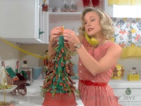 Kristen Bell plays host to a Christmas Eve party in Sia's new video Santa's Coming For Us. (SiaVEVO/YouTube)