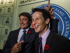 2017 Hockey Hall of Fame inductees Teemu Selanne (left) and Paul Kariya (right) joke around after a press conference in Toronto, on Friday, Nov. 10, 2017. (Christopher Katsarov/The Canadian Press)