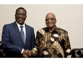 In this photo supplied by Government Communications and Information Services, (GCIS) former Vice-President of Zimbabwe, Emmerson Mnangagwa, left, shakes hands with South Africa President Jacob Zuma during a short visit, in Pretoria, South Africa, Wednesday, Nov. 22, 2017. Zimbabwe's incoming leader has departed from an airport in neighboring South Africa to make his return to his country. (Ntswe Mokoena/GCIS via AP) ORG XMIT: PRE101

AP PROVIDES ACCESS TO THIS PUBLICLY DISTRIBUTED HANDOUT PHOTO PROVIDED BY GCIS; MANDATORY CREDIT.
Ntswe Mokoena, AP