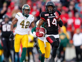 The Calgary Stampeders' Roy Finch runs by Edmonton Eskimos to score a touchdown during CFL Western Final action at McMahon Stadium in Calgary, Alta.. on Sunday November 19, 2017.