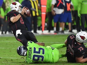Arizona Cardinals' quarterback Drew Stanton is sacked by defensive end Dion Jordan of the Seattle Seahawks in the second half at University of Phoenix Stadium on Nov. 9, 2017 in Glendale, Ariz.   (Norm Hall/Getty Images)