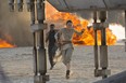 This photo provided by Disney/Lucasfilm shows Daisy Ridley, right, as Rey, and John Boyega as Finn, in a scene from the film, "Star Wars: The Force Awakens," directed by J.J. Abrams. (David James/Disney/Lucasfilm)